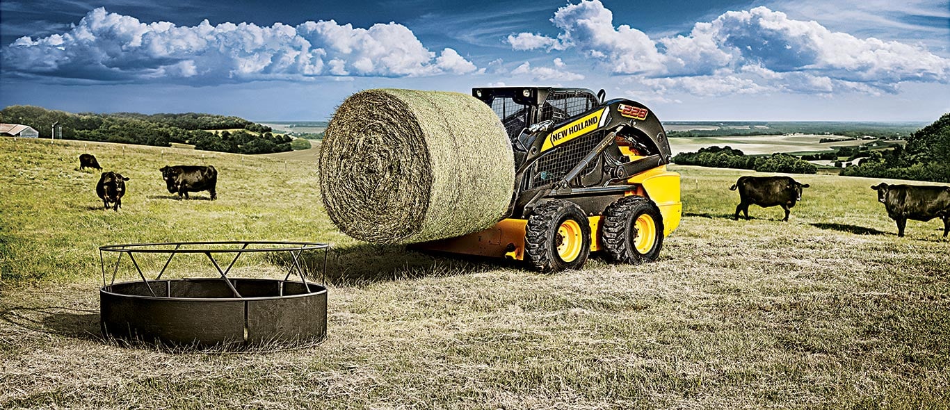 New Holland Skid Steer Moving Hay